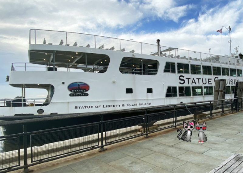 Stinky Periwinkle Statue of Liberty: Statue of Liberty ferry with two cartoon tabby cats.