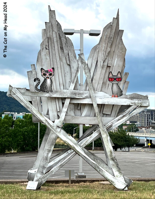 Periwinkle Stinky Charles Brouwer Large white wooden star sculpture with two cartoon tabby cats standing on a cross beam about halfway up.