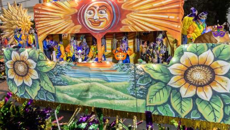 Periwinkle Stinky Mardi Gras A ginger tabby cat in a Mardi Gras mask and king's crown and two grey cartoon tabby cats in Mardi Gras masks on an Excalibur float.