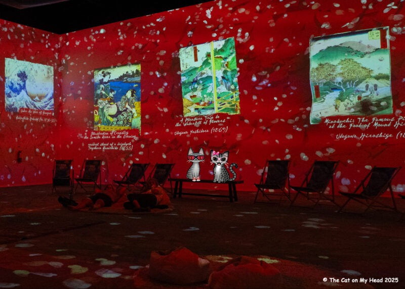 Van Gogh Experience Two cartoon tabby cats in a display of Van Gogh's Japanese paintings from Van Gogh Immersive Experience.