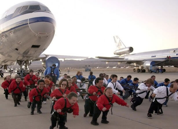 POEM THANKFULS ANGEL 44 little people harnessed together and pulling a jetliner.