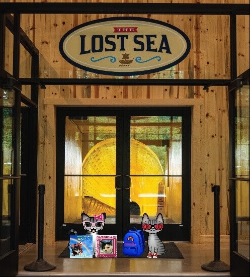 Two cartoon tabby cats at the Lost Sea Adventure in Sweetwater, TN.